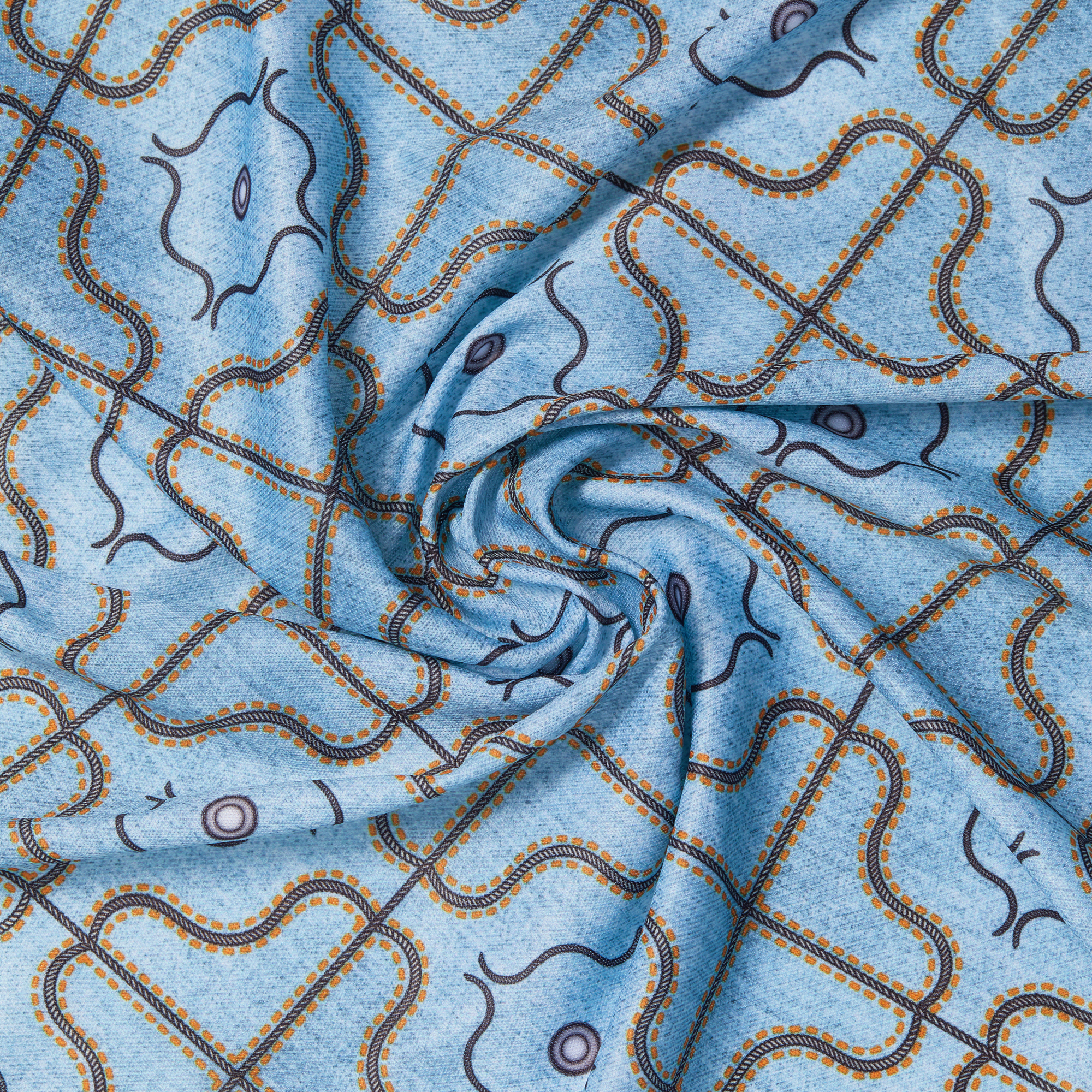 The image features a piece of fabric with a swirling pattern. The fabric is predominantly light blue, adorned with intricate designs in darker blue and gold. The pattern consists of interlocking shapes, including curves and circles, arranged in a grid-like formation. The overall effect is a visually appealing textile that combines elegance with a modern touch.
