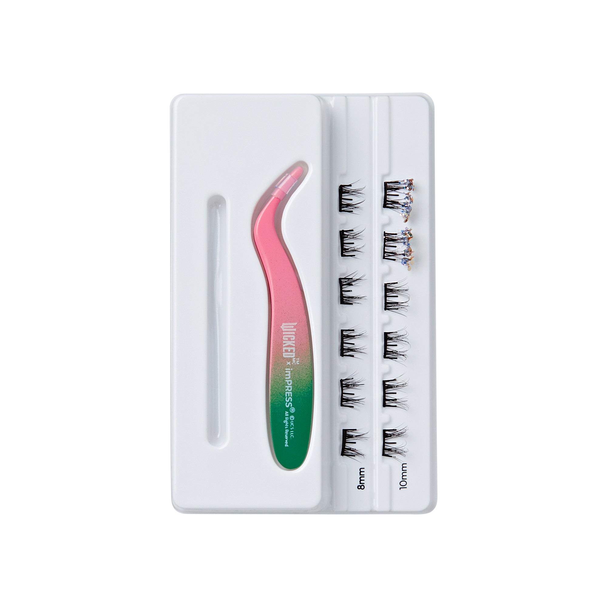 White tray containing a pink and green curved tweezer labeled \