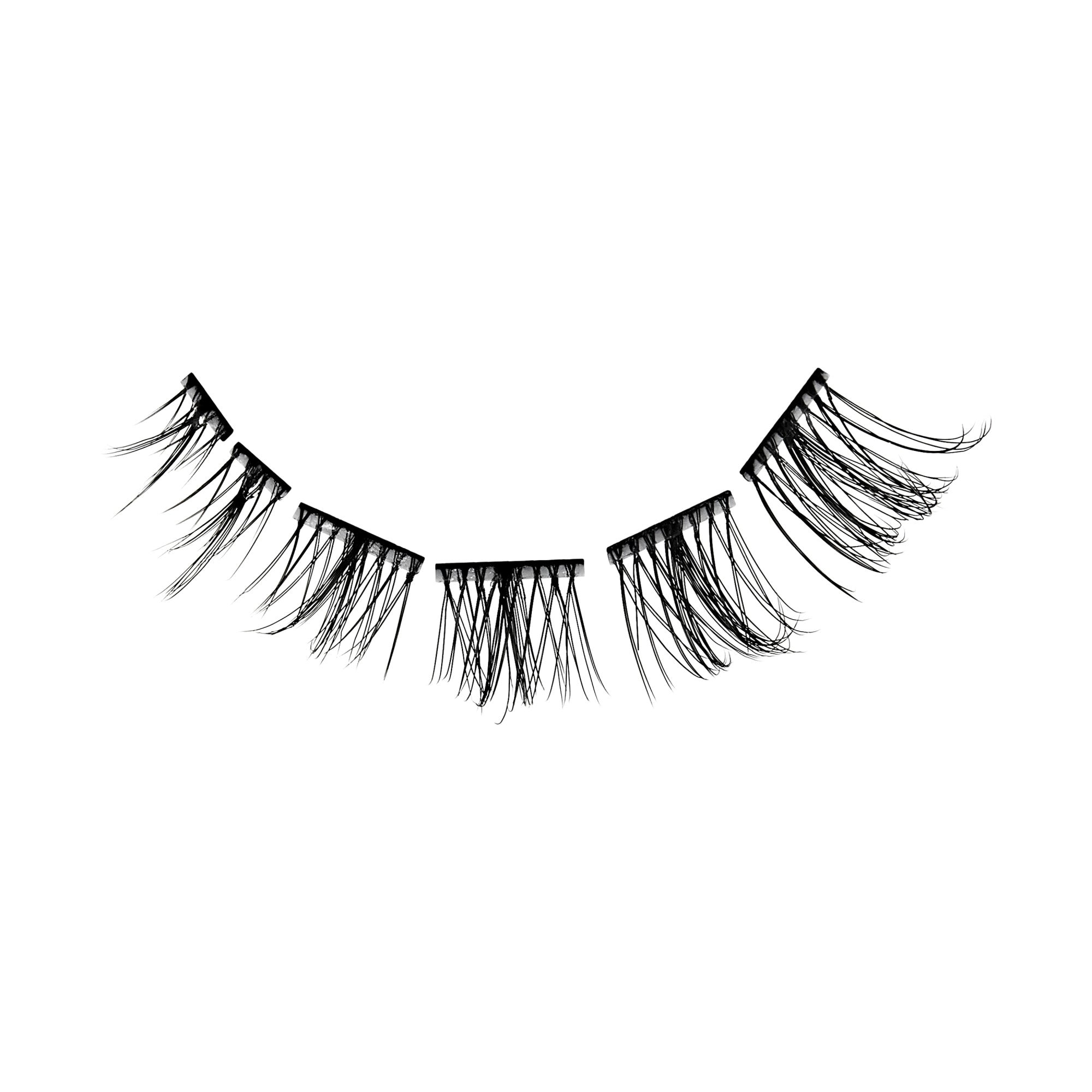 The image features a set of false eyelashes arranged in a curved line. The lashes are black and vary in length, with longer strands on the outer edges and shorter ones towards the center. The overall appearance is delicate and feathery, showcasing a dramatic yet elegant style suitable for enhancing eye makeup. The background is plain white, emphasizing the lashes&