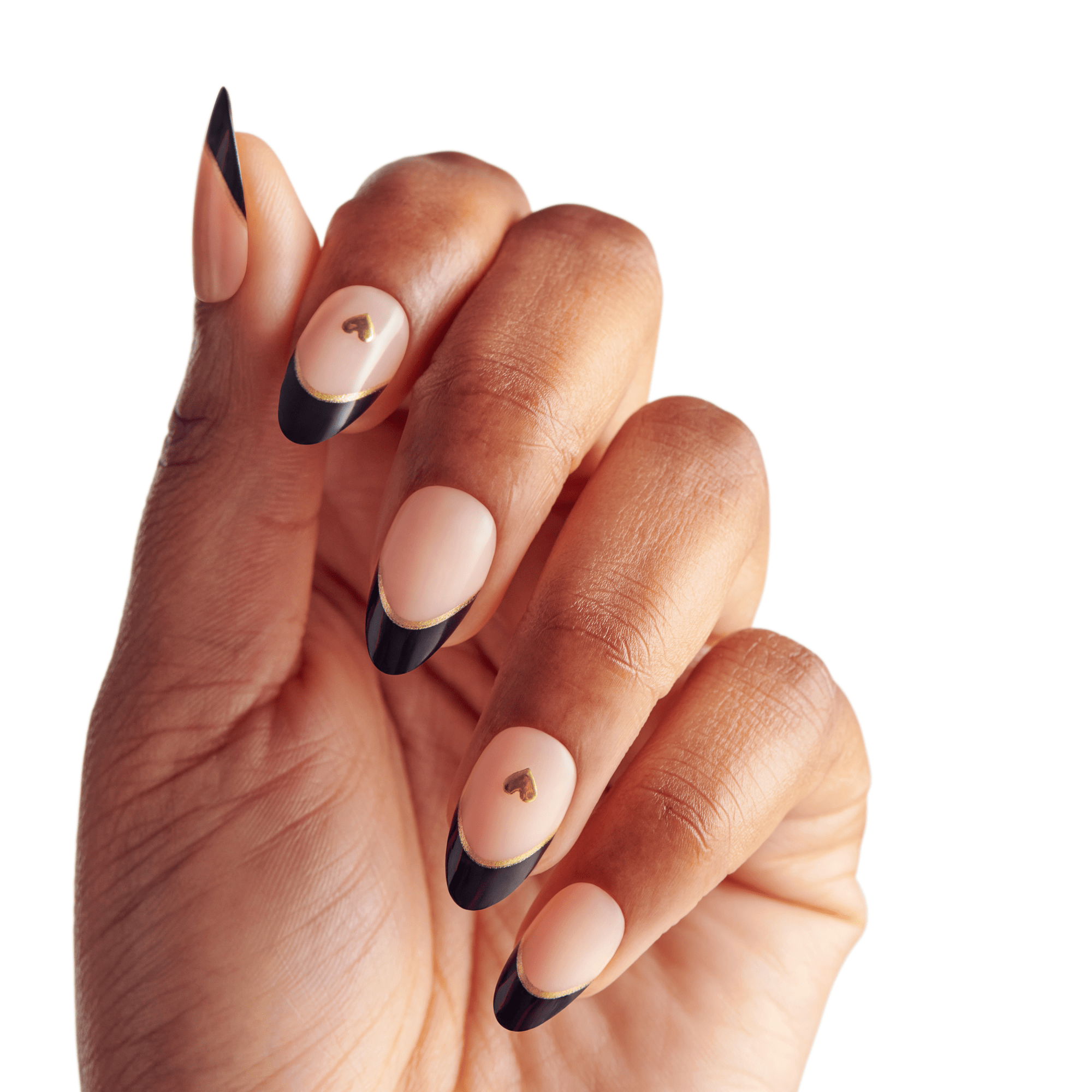 The image features a hand with elegantly manicured nails. The nails are designed with a nude base and have a striking black tip, creating a French manicure effect. Additionally, some nails are adorned with small gold heart accents, adding a touch of charm and sophistication to the overall look. The hand is positioned in a way that highlights the nail art, showcasing the contrast between the nude and black colors.