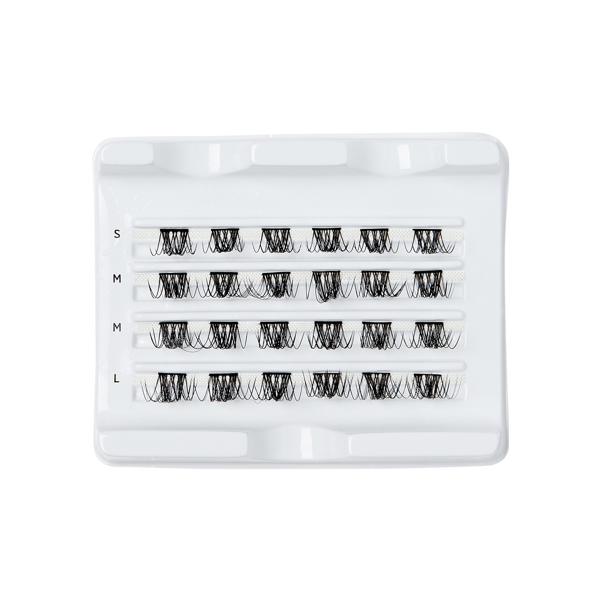 The image shows a white plastic tray containing multiple pairs of false eyelashes. The tray is organized into four rows, each labeled with a different size: S (small), M (medium), M (medium), and L (large). Each row holds several pairs of eyelashes, neatly arranged in a horizontal line. The eyelashes appear to be black and are designed to enhance the volume and length of natural lashes. The tray is likely used for storage and easy access to the different sizes of false eyelashes.