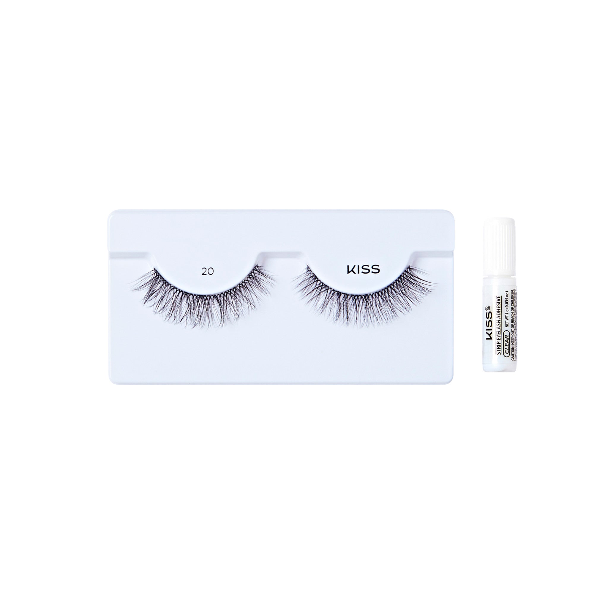 The image shows a set of false eyelashes and an adhesive glue. The false eyelashes are displayed on a white tray, with each lash labeled "20" and "KISS." The lashes are long and voluminous, designed to enhance the appearance of natural eyelashes. To the right of the tray, there is a small tube of adhesive glue, which is used to apply the false eyelashes. The glue tube is white with black text on it. The overall presentation is clean and minimalistic.