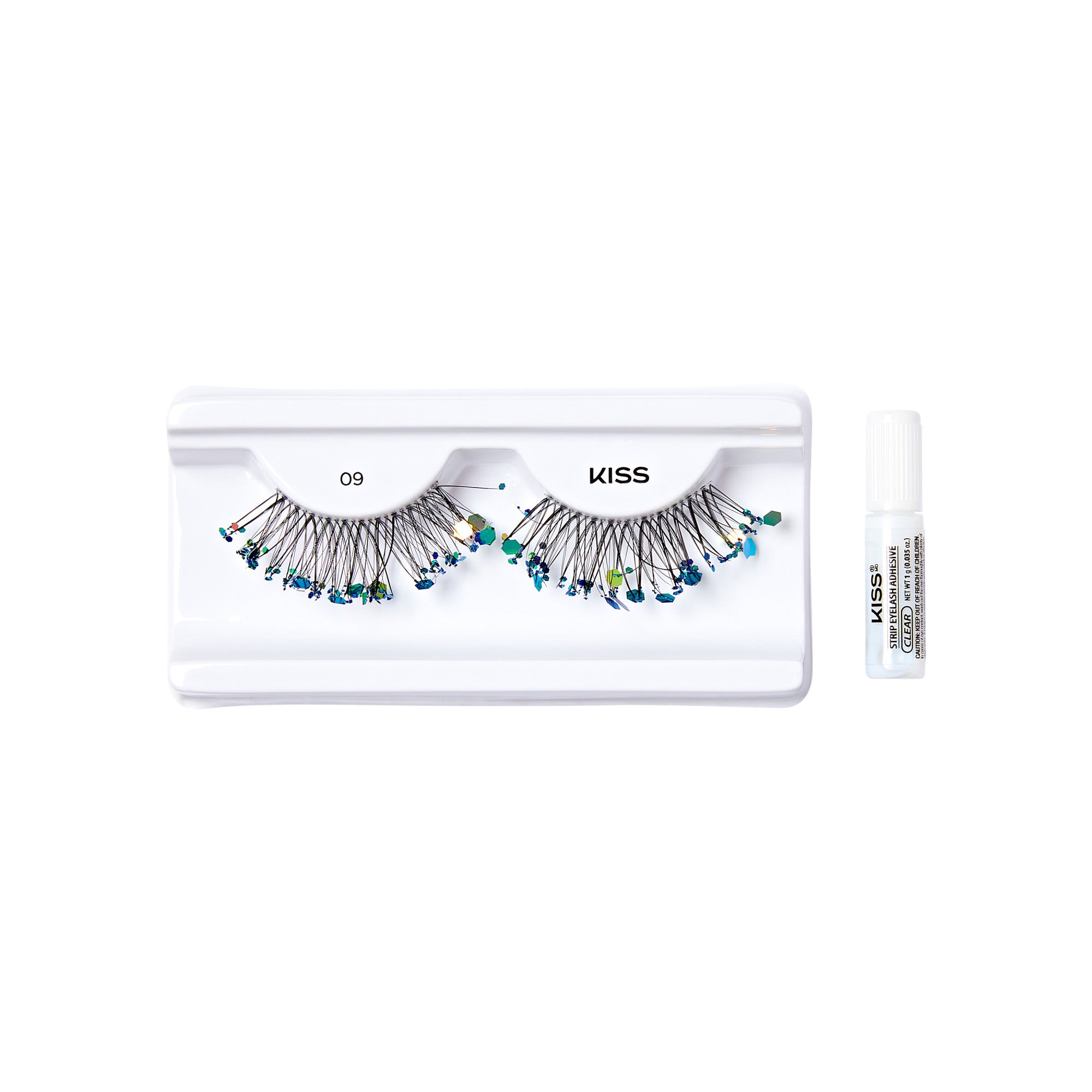 The image shows a set of false eyelashes from the brand "KISS." The eyelashes are displayed on a white plastic tray with the number "09" printed on it. The lashes are adorned with small, colorful beads or gems, adding a decorative touch. To the right of the tray, there is a small white tube of adhesive, also branded with "KISS," which is used to apply the false eyelashes. The overall presentation is clean and organized, highlighting the product&