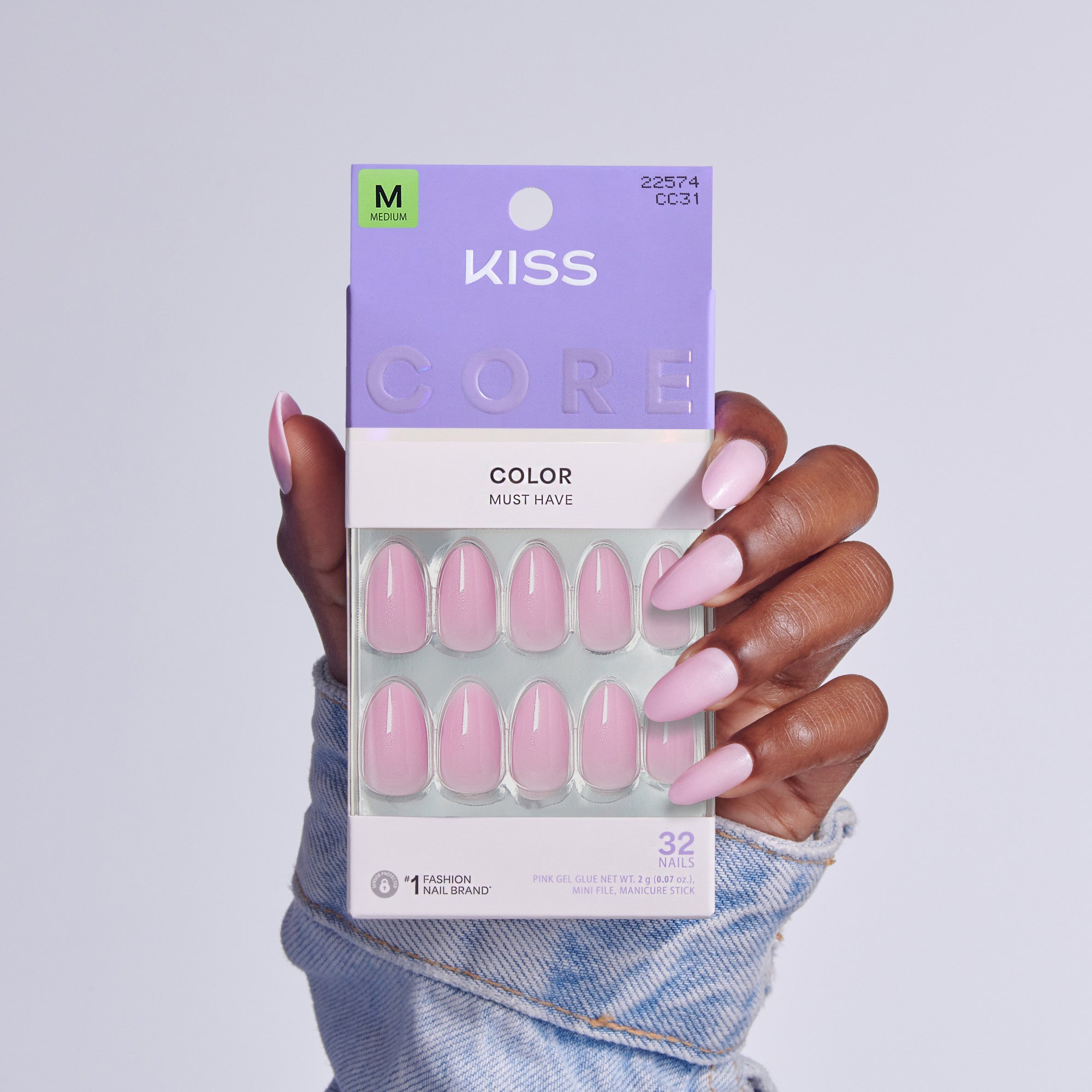 Kiss Core Color Must Have press-on nails in pink, size M, displayed on hand.