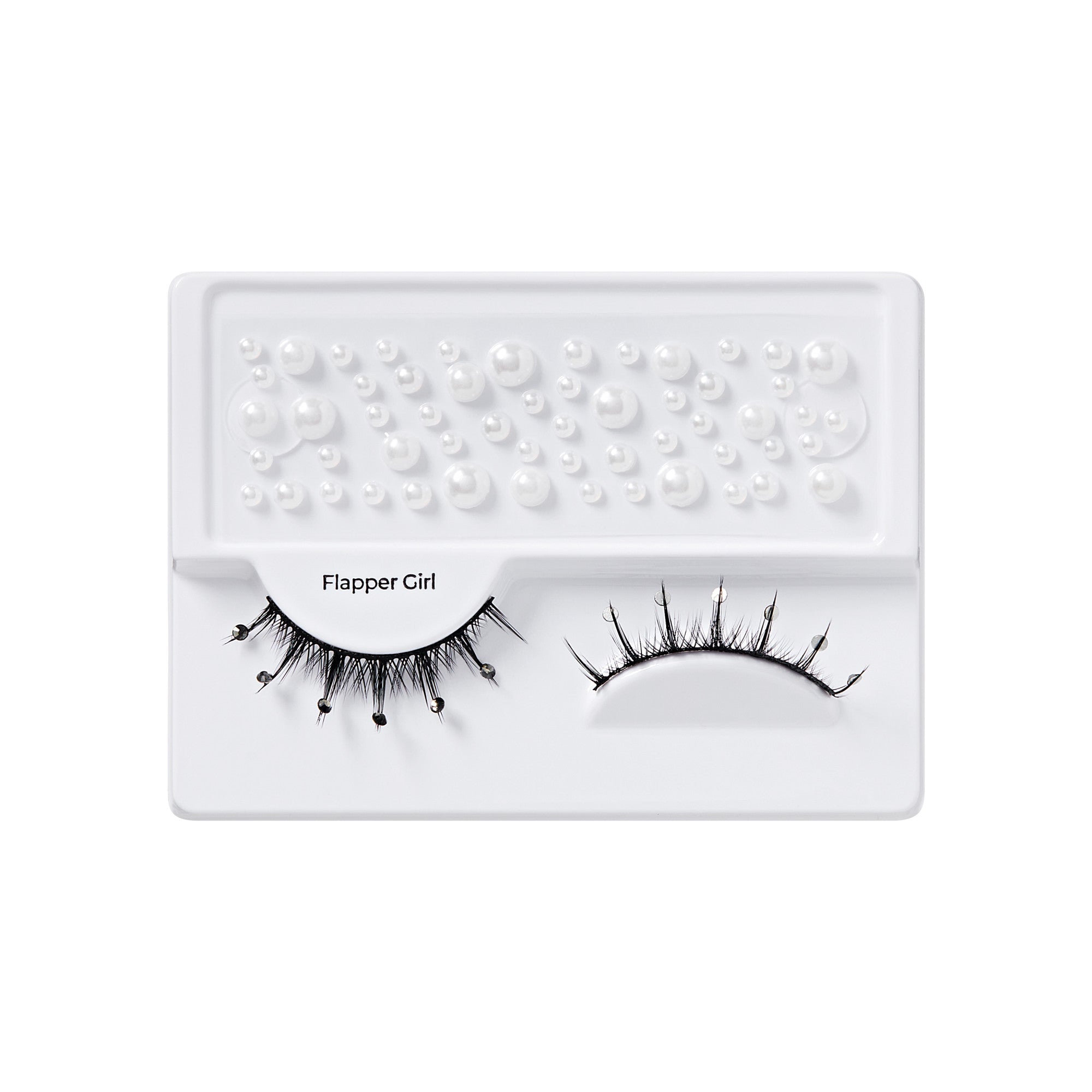 Black false lashes with small attached clear gems and a variety of adhesive white pearl stickers in multiple sizes, labeled \