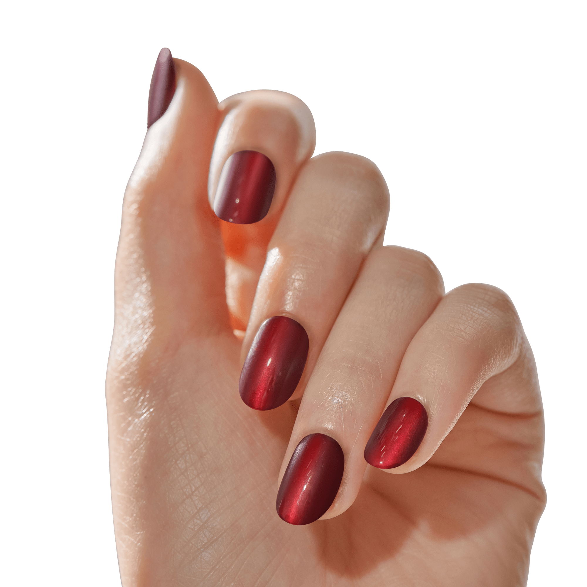 Hand with medium-length, oval-shaped press-on nails in a deep, shimmery red shade called Hidden Gem, shown from a tilted top view.