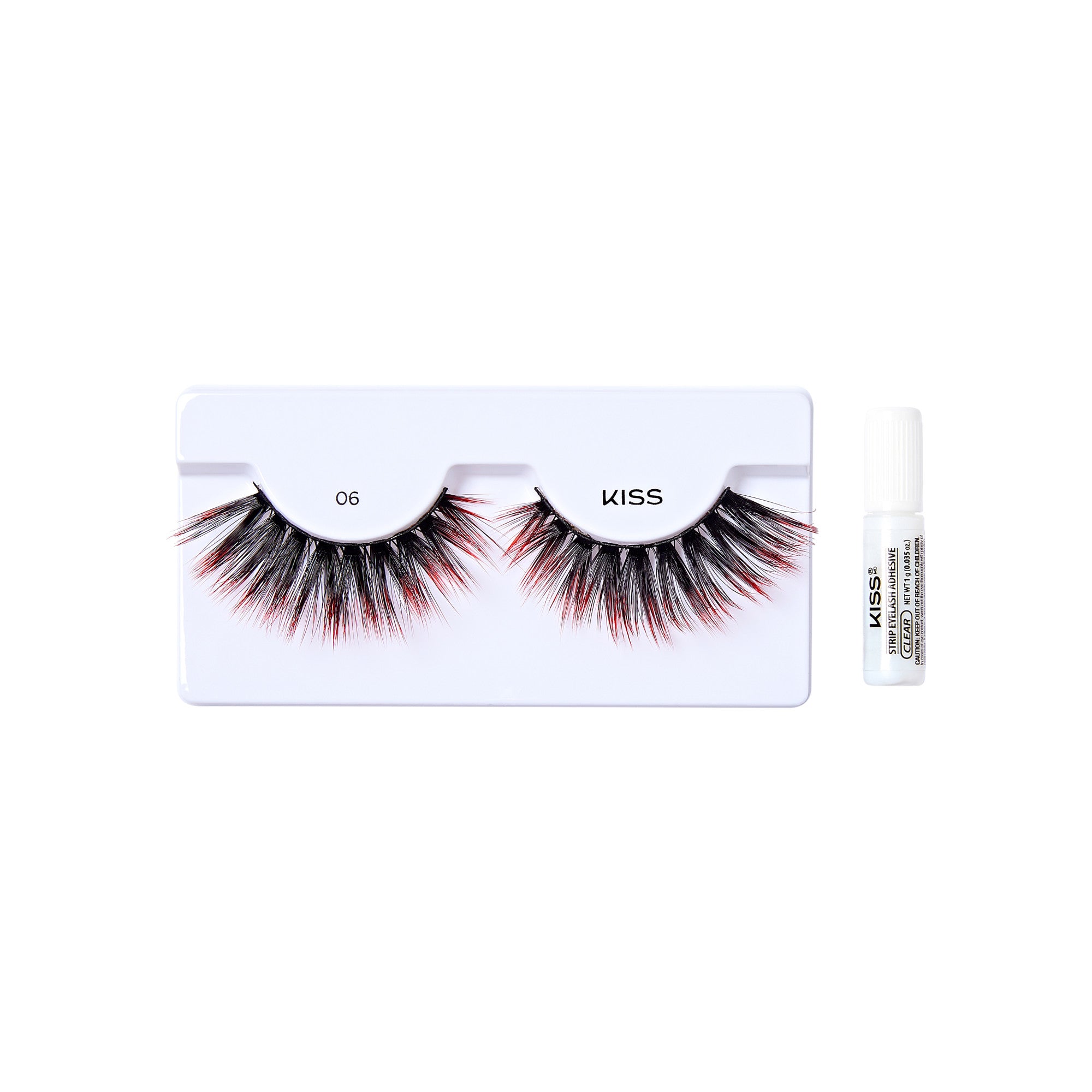 The image shows a set of false eyelashes from the brand "KISS." The eyelashes are displayed in a white plastic tray with the number "06" printed on it. The lashes are voluminous and have a mix of black and red fibers, giving them a dramatic look. Alongside the eyelashes, there is a small white tube of adhesive glue, also branded with "KISS," which is used to apply the lashes. The overall presentation is clean and professional, suitable for retail display.