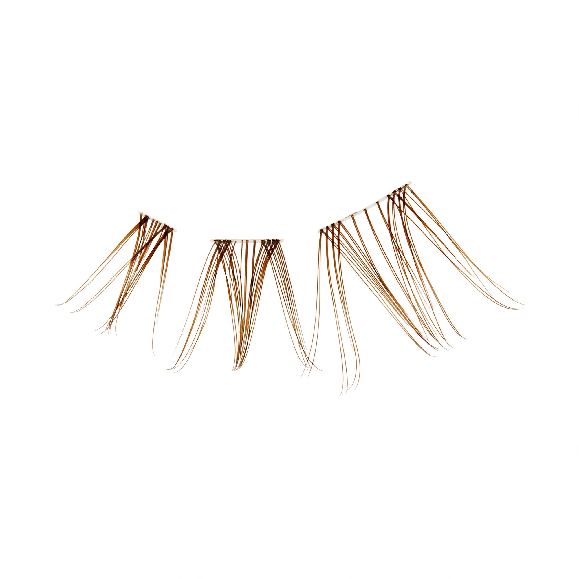 The image features a set of false eyelashes arranged in a fan-like shape. The lashes are long and slender, with a gradient of color that transitions from a darker shade at the base to a lighter hue at the tips. The design includes three distinct sections, each with varying lengths, creating a dramatic and fluttery effect suitable for enhancing eye makeup. The background is plain white, emphasizing the lashes&