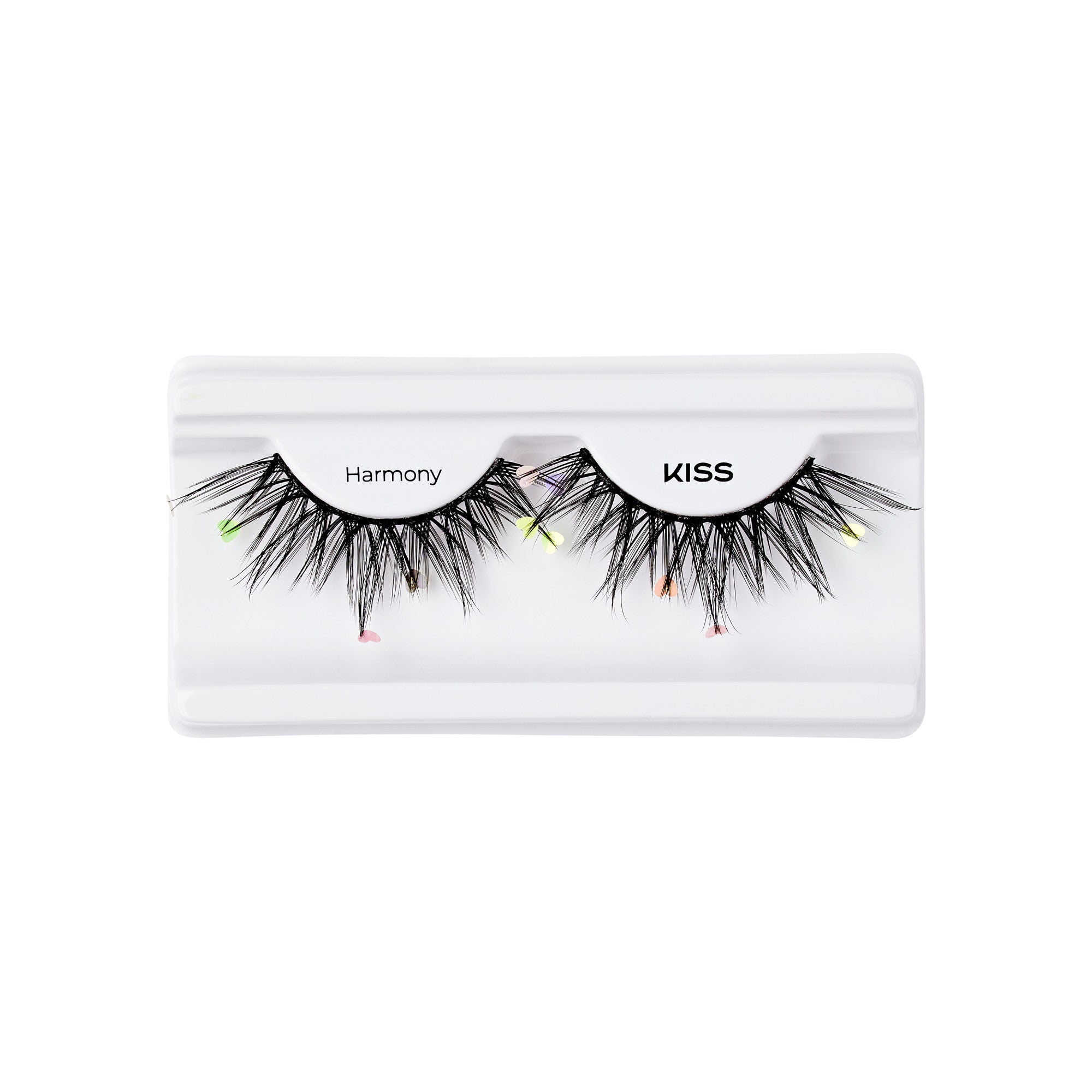 The image shows a pair of false eyelashes in a white plastic case. The eyelashes are labeled "Harmony" and "KISS." They are black and feature a dramatic, voluminous design with colorful accents at the tips, including small neon green, pink, and orange highlights. The case has a simple, clean design, allowing the eyelashes to be prominently displayed.