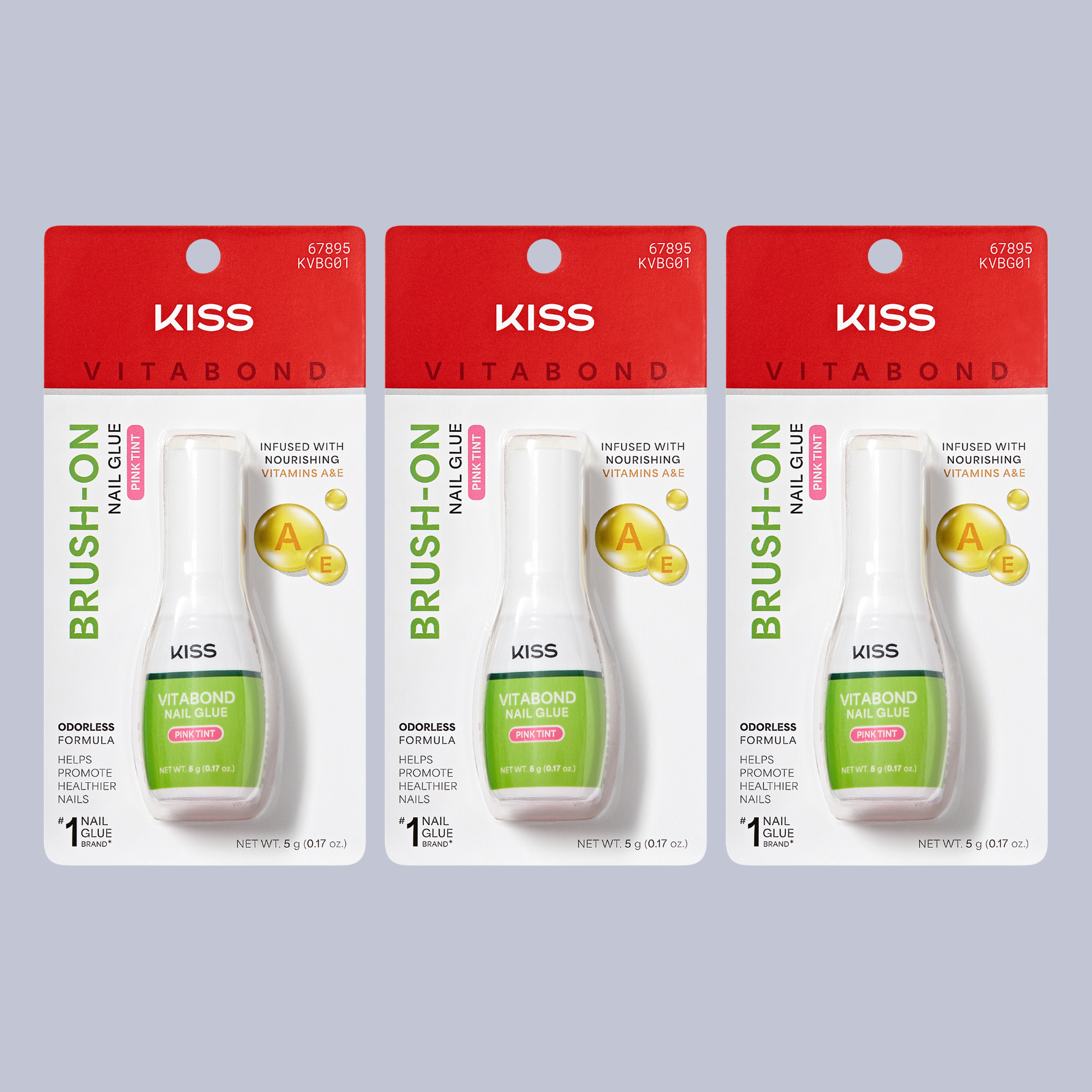 Three packages of Kiss Vitabond Brush-On Nail Glue on a gray background