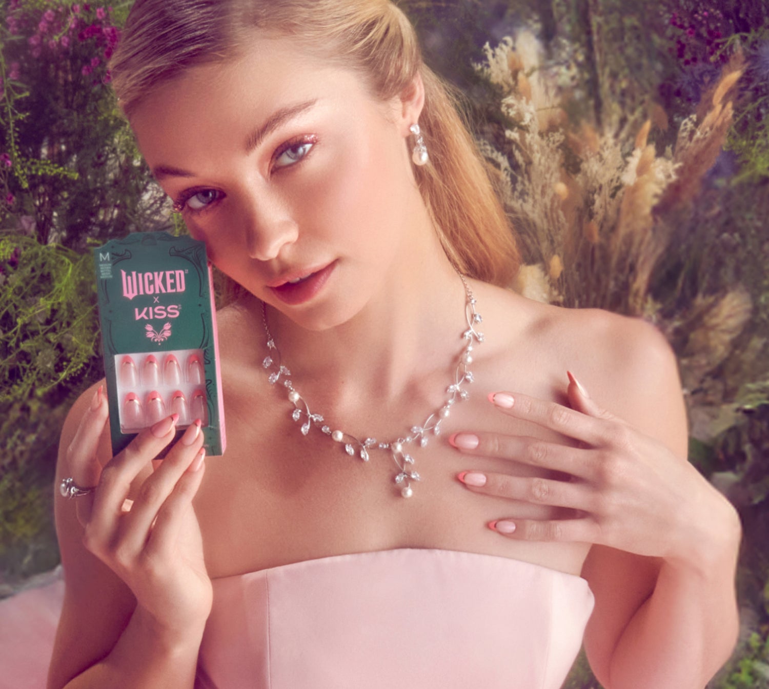 A woman modeling Wicked X Kiss Nails