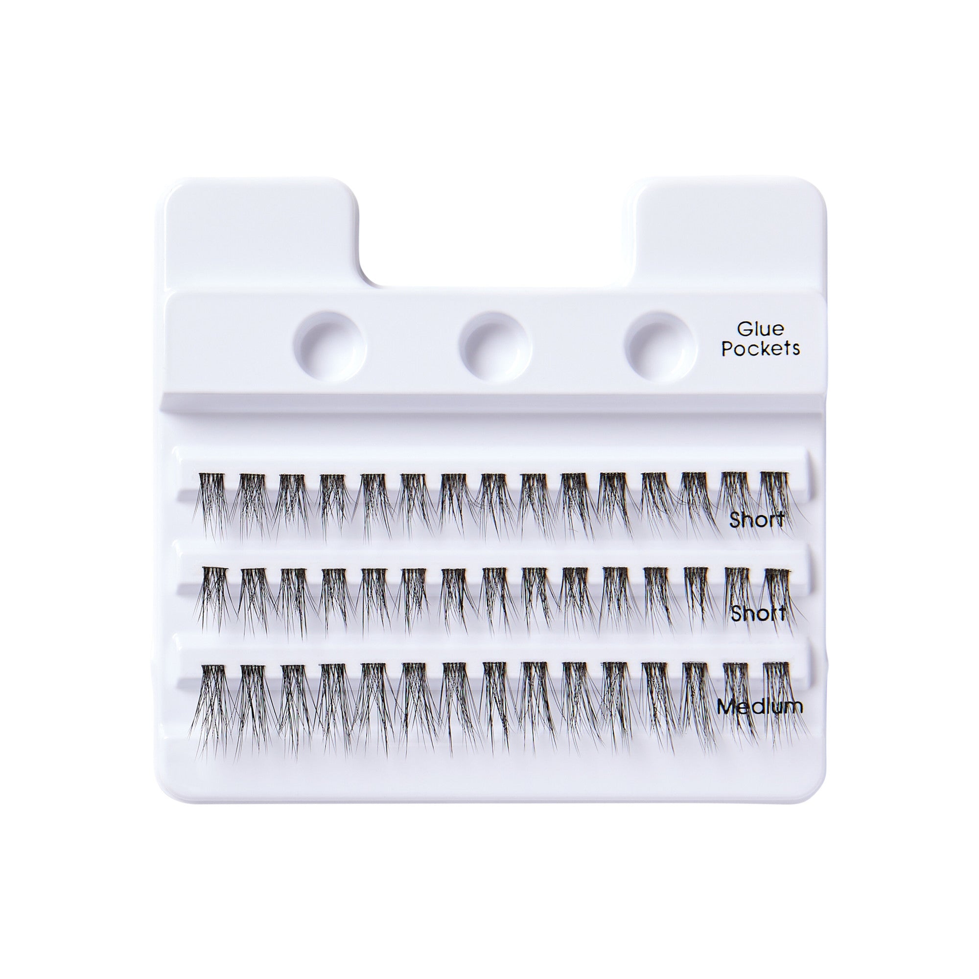 White plastic tray holding three rows of black false lash clusters labeled \
