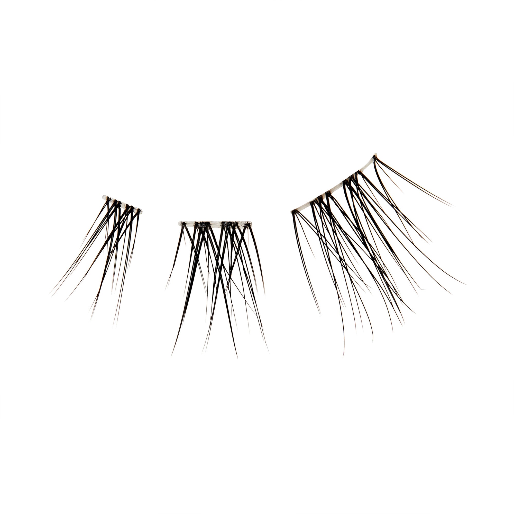 The image features three clusters of long, thin, black hair strands arranged in a way that resembles eyelashes. The strands vary in length and are positioned in a curved manner, creating a natural look. The background is plain white, emphasizing the delicate and intricate details of the hair strands.