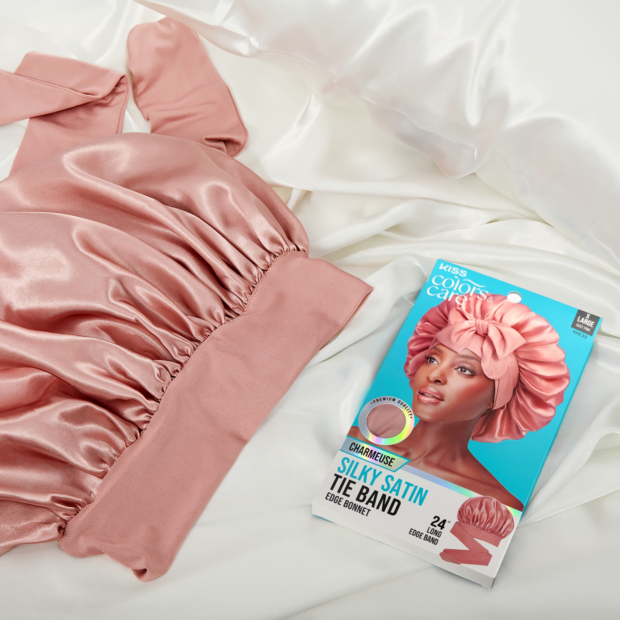 Pink satin tie band with packaging on a white fabric background