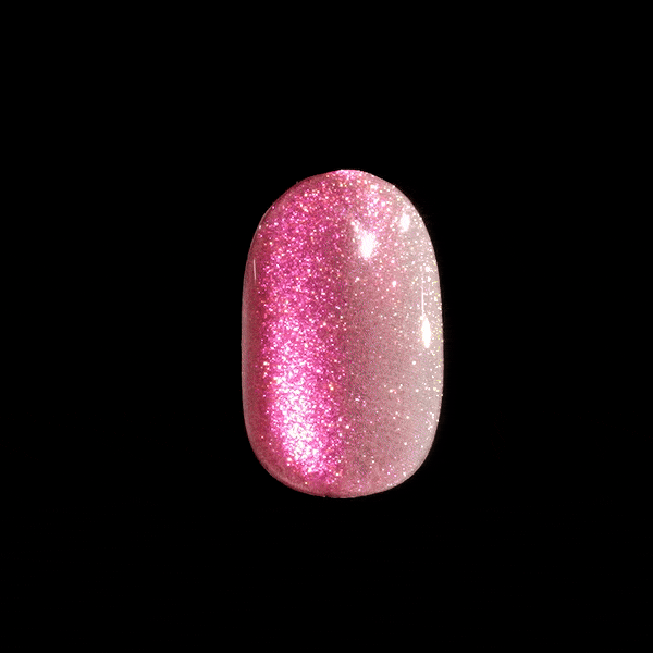 Press-on nail with a half-and-half glitter design, featuring bright pink sparkles on one side and pale pink glitter on the other, shown against a black background.