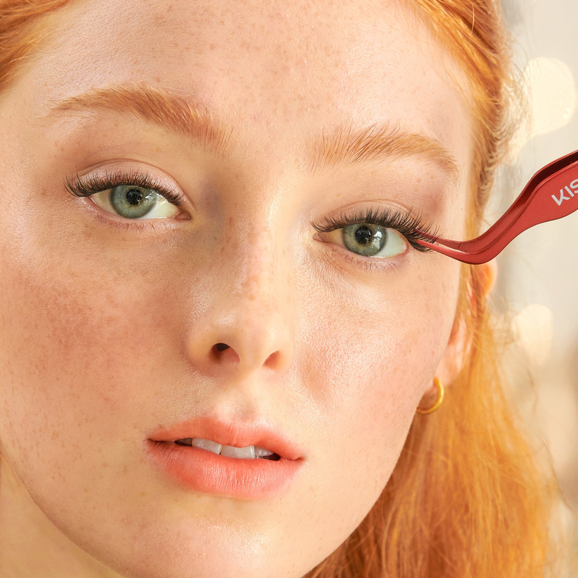 Red eyeliner being applied to a woman&