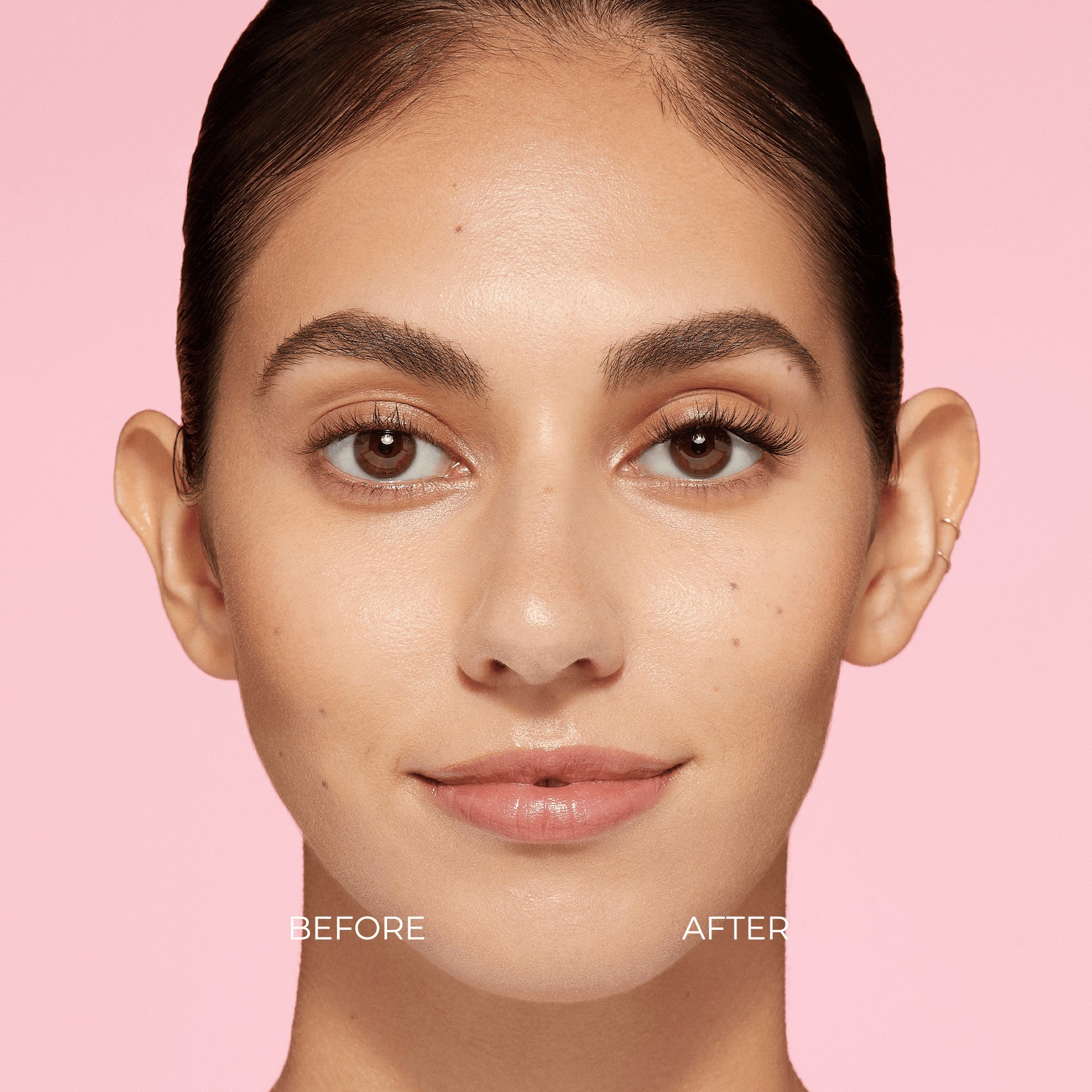 Close-up of a woman’s face against a pink background showing a before and after comparison of eyelashes; left eye natural lashes, right eye enhanced with fuller, longer false lashes.