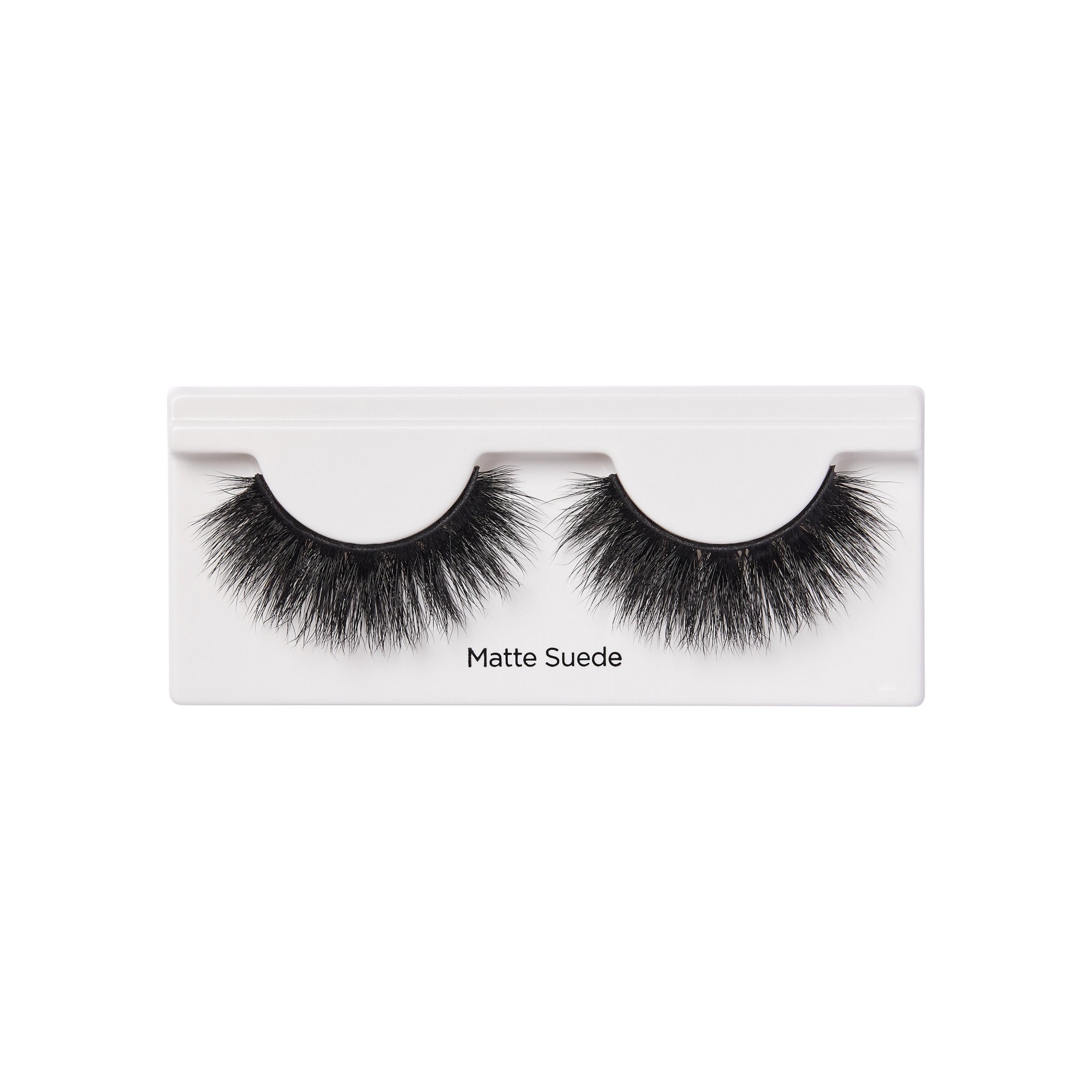Matte Suede false eyelashes in white packaging with black lashes displayed