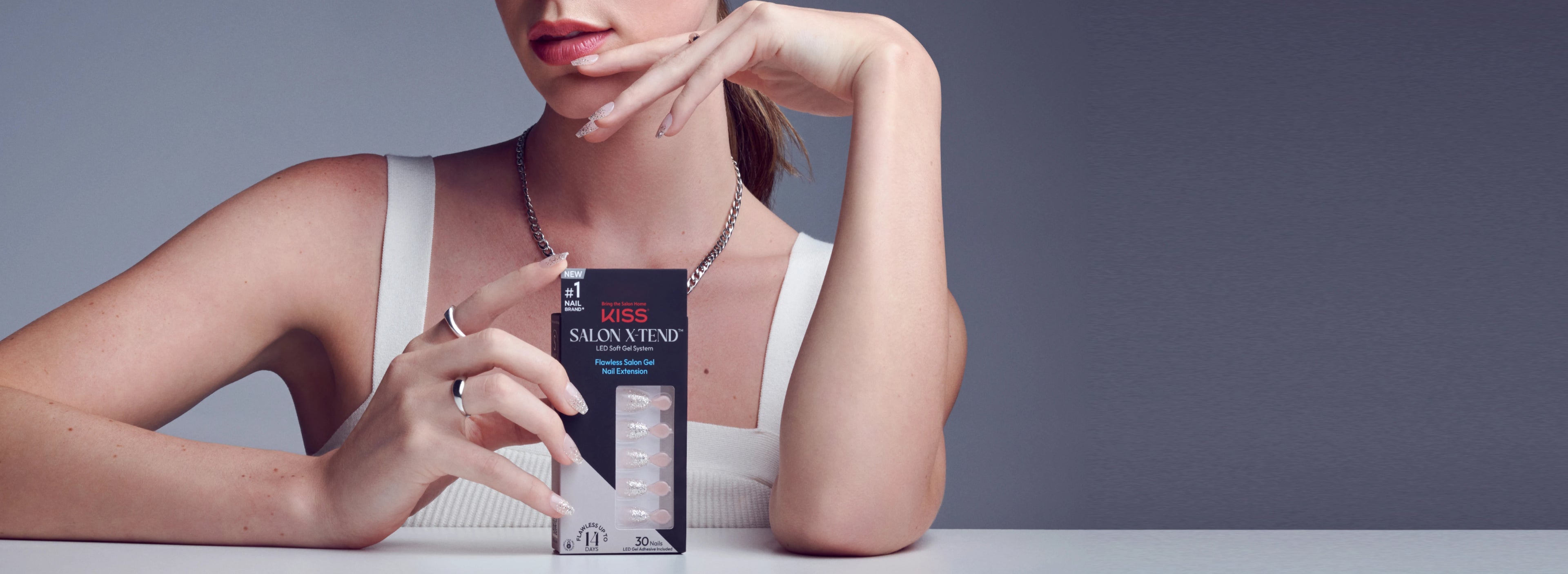 Woman modeling Salon X-tend nails