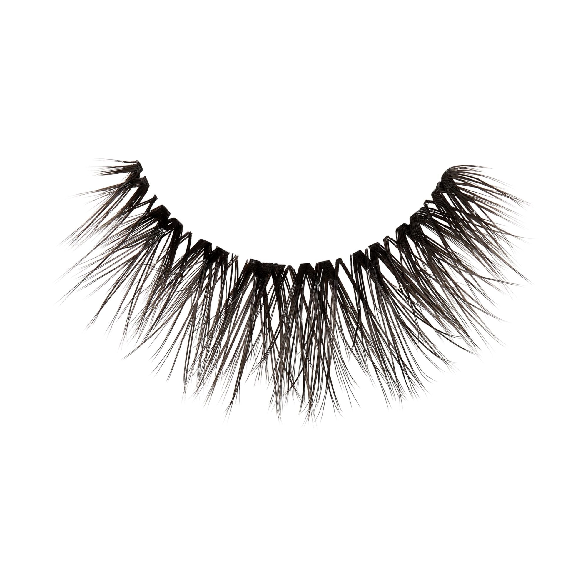 Single black false eyelash from KISS Lash Couture LuXtensions, featuring a crisscross pattern and wispy, voluminous strands on a clear band.