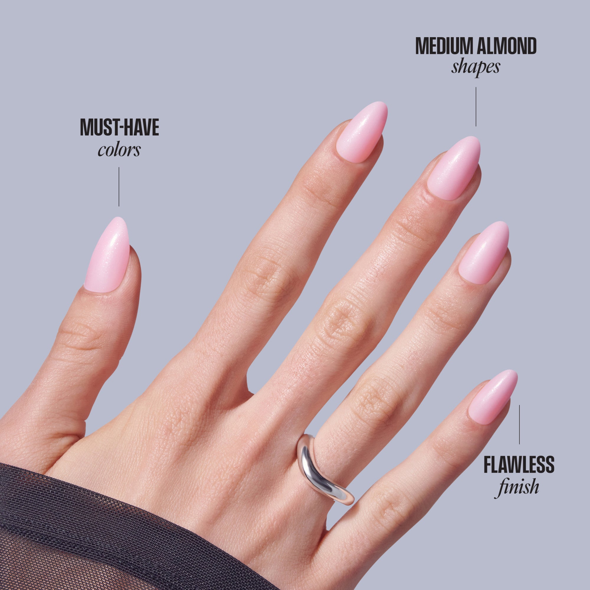 Medium almond pink nails with glossy finish on hand wearing silver ring.