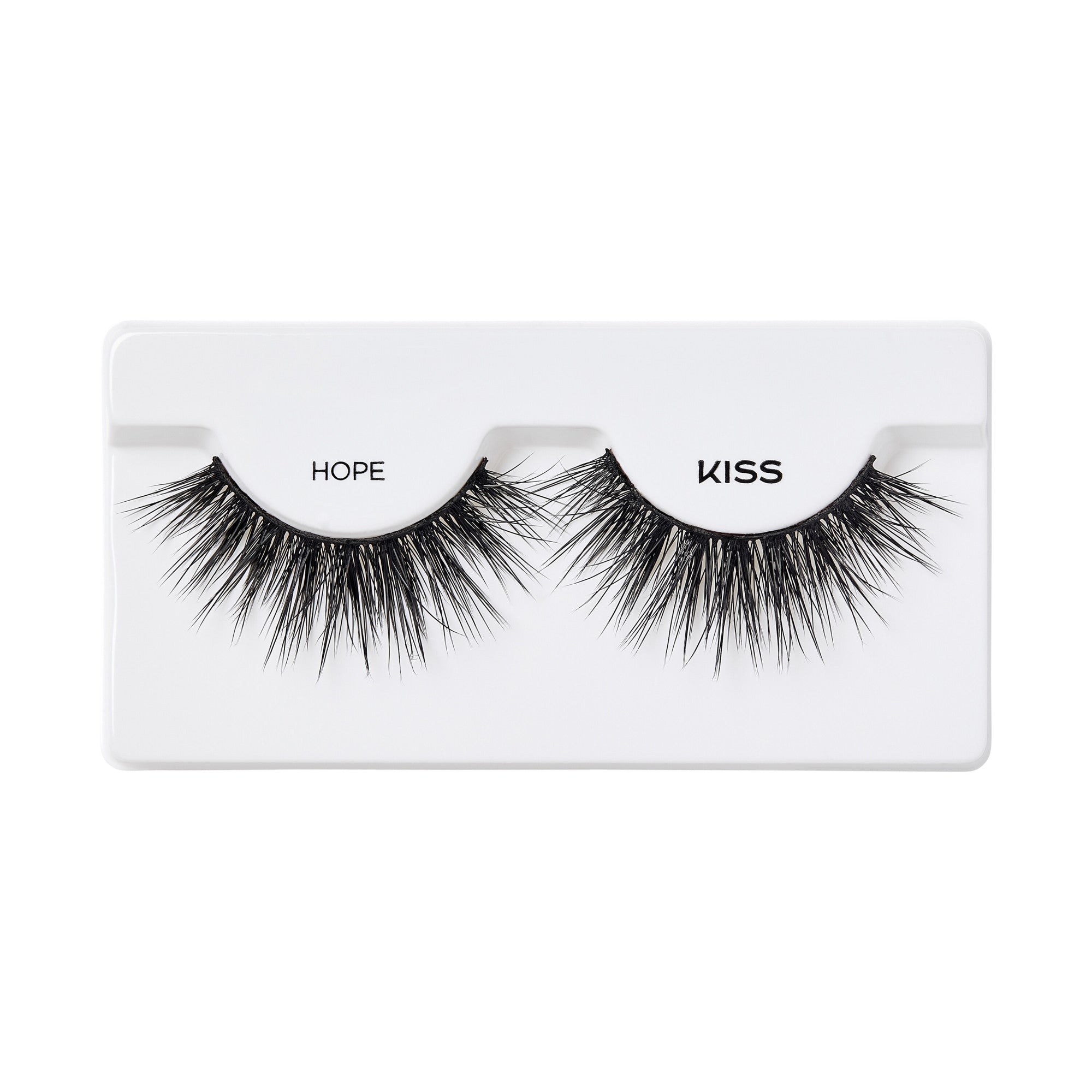 Pair of black false eyelashes labeled ‘Hope’ by KISS, displayed on a white plastic tray, showing full and wispy lash design.