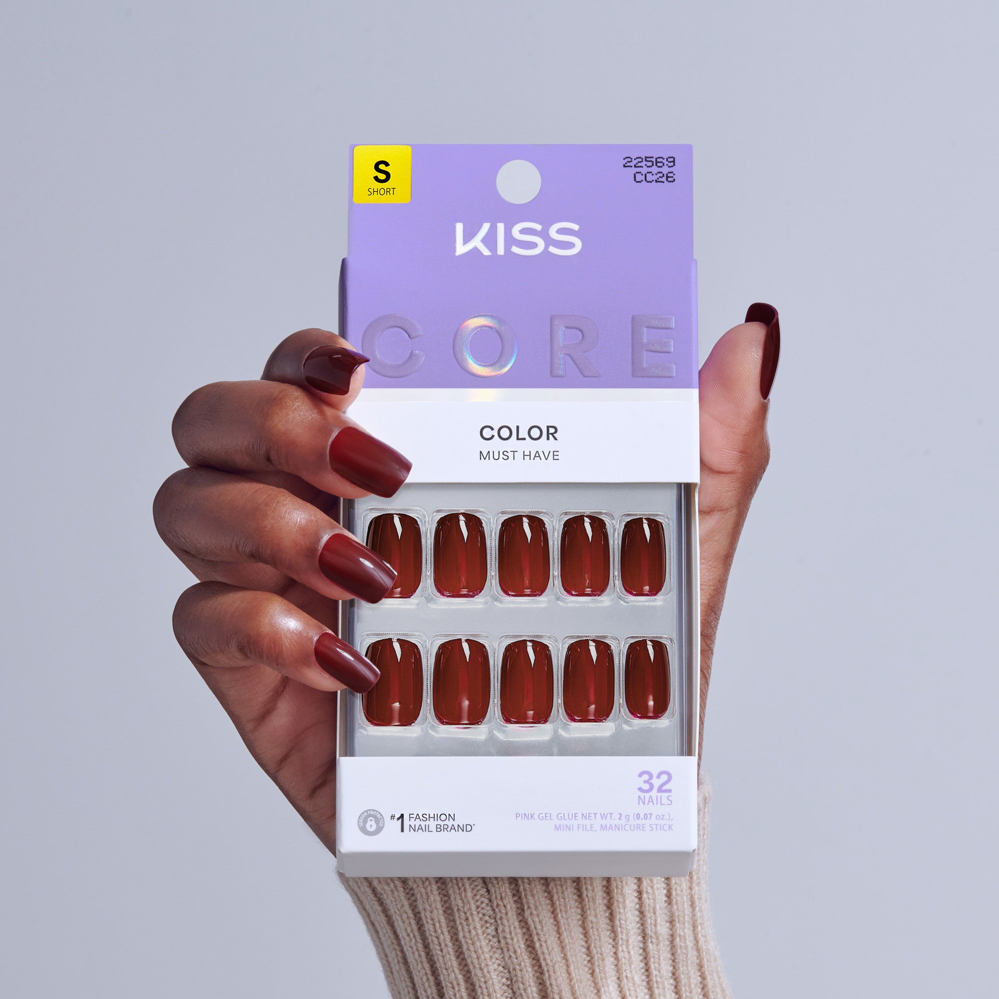 KISS Core Color Must Have press-on nails in deep burgundy red, size short, 32 nails displayed on packaging.