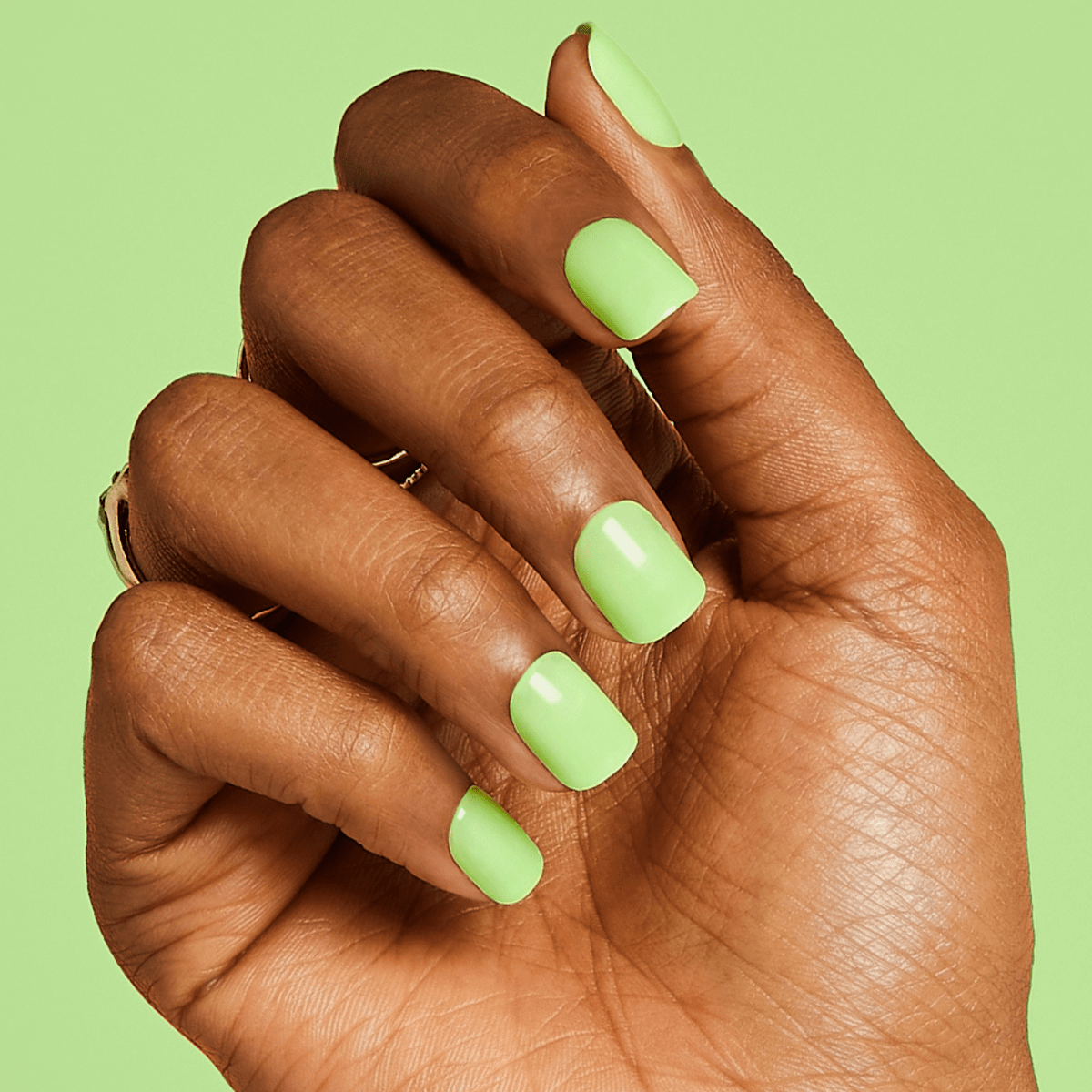 Female hand with long nails and neon green manicure with bottles of nail  polish Stock Photo | Adobe Stock