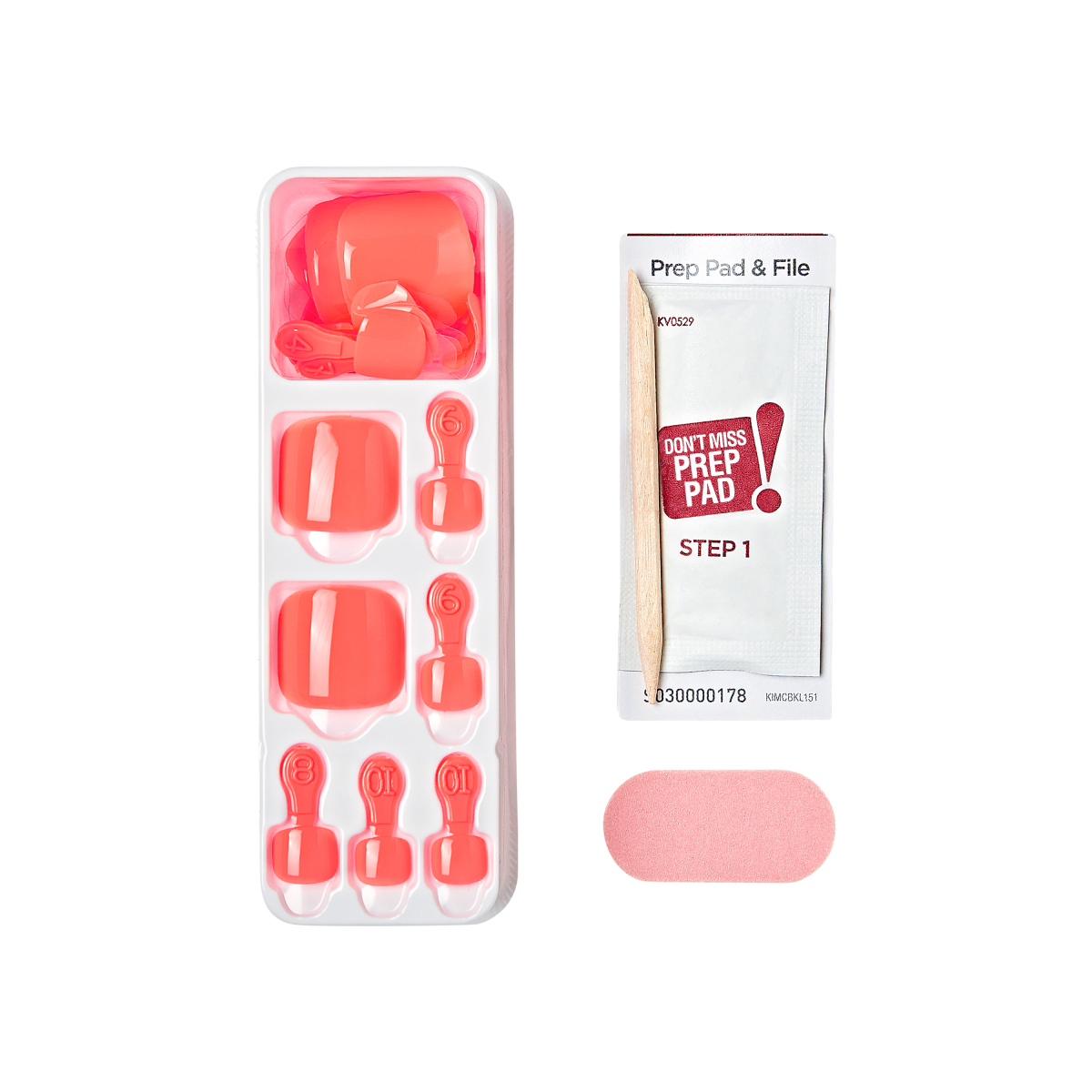 Bright coral-colored press-on toenails sized and arranged in a white tray, accompanied by a wooden stick, a pink nail file, and a prep pad packet labeled \