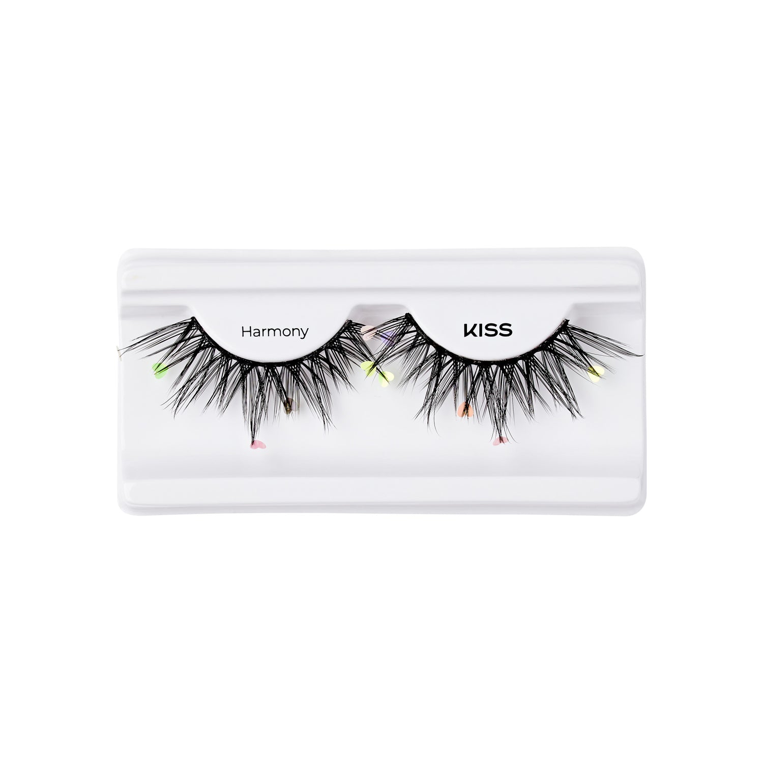 The image shows a pair of false eyelashes in a white plastic case. The eyelashes are labeled "Harmony" and "KISS." They are black and feature a dramatic, voluminous design with colorful accents at the tips, including small neon green, pink, and orange highlights. The case has a simple, clean design, allowing the eyelashes to be prominently displayed.