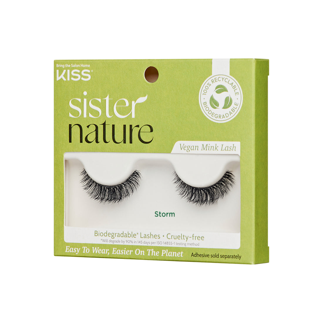 The image shows a product package for "KISS Sister Nature" vegan mink lashes. The packaging is predominantly green with white text. The lashes are named "Storm" and are visible through a clear window on the front of the package. The package highlights that the lashes are biodegradable and cruelty-free, made with 100% natural fibers. It also mentions that the packaging is 100% recyclable. The bottom of the package states, "Easy To Wear, Easier On The Planet," and notes that adhesive is sold separately.