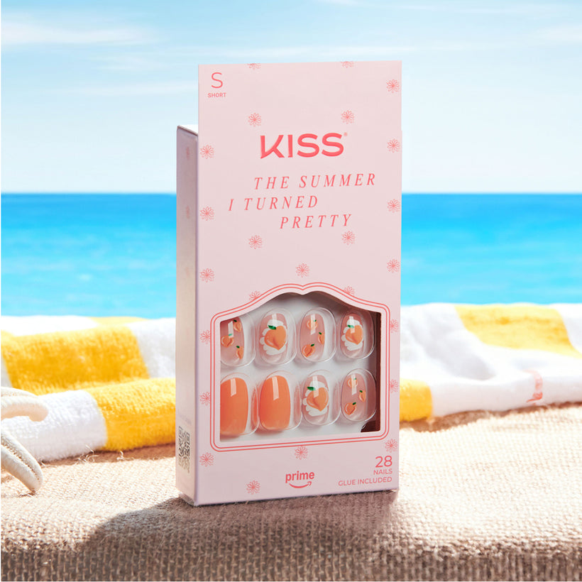 KISS "The Summer I Turned Pretty" short nail set on beach background with sunscreen.