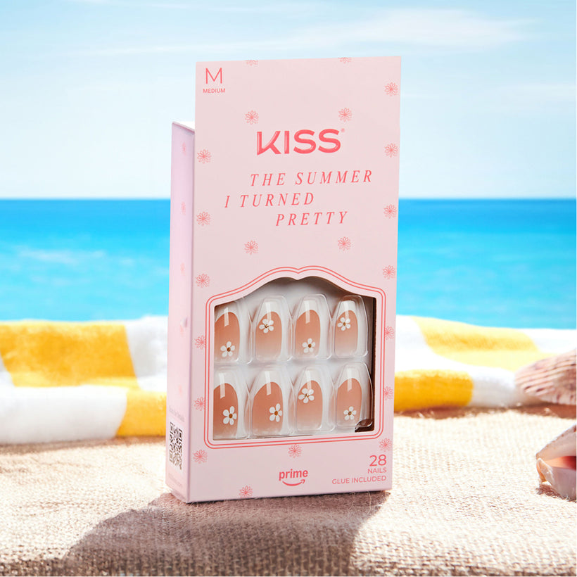 KISS "The Summer I Turned Pretty" medium press-on nails with floral design on beach.