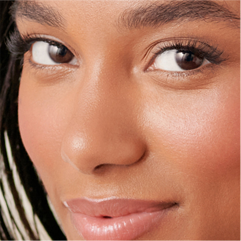 Woman wearing KISS imPRESS Demi-Bold false lashes, close-up beauty shot