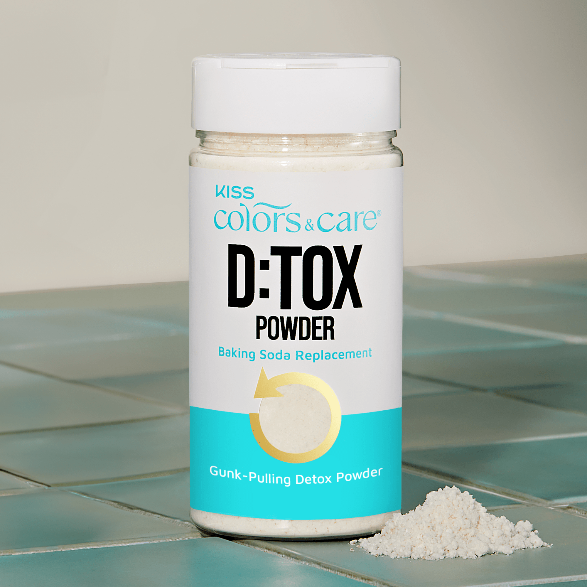 Bottle of D:TOX Powder on a tiled surface with a neutral background