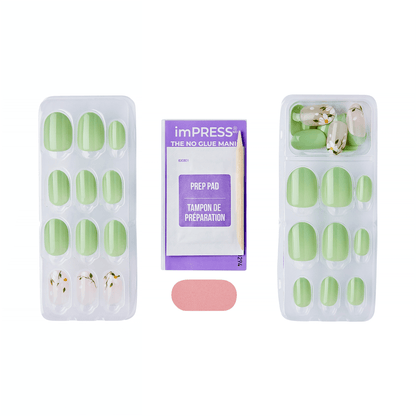 The image features a set of artificial nails arranged in two trays. The nails are predominantly green, with some featuring floral designs. In the center, there is a prep pad package labeled "imPRESS THE NO GLUE MAN!" which is designed for preparing the nails for application. Additionally, a small pink adhesive strip is included, likely for securing the nails. The overall presentation suggests a manicure kit that emphasizes ease of use without the need for glue.