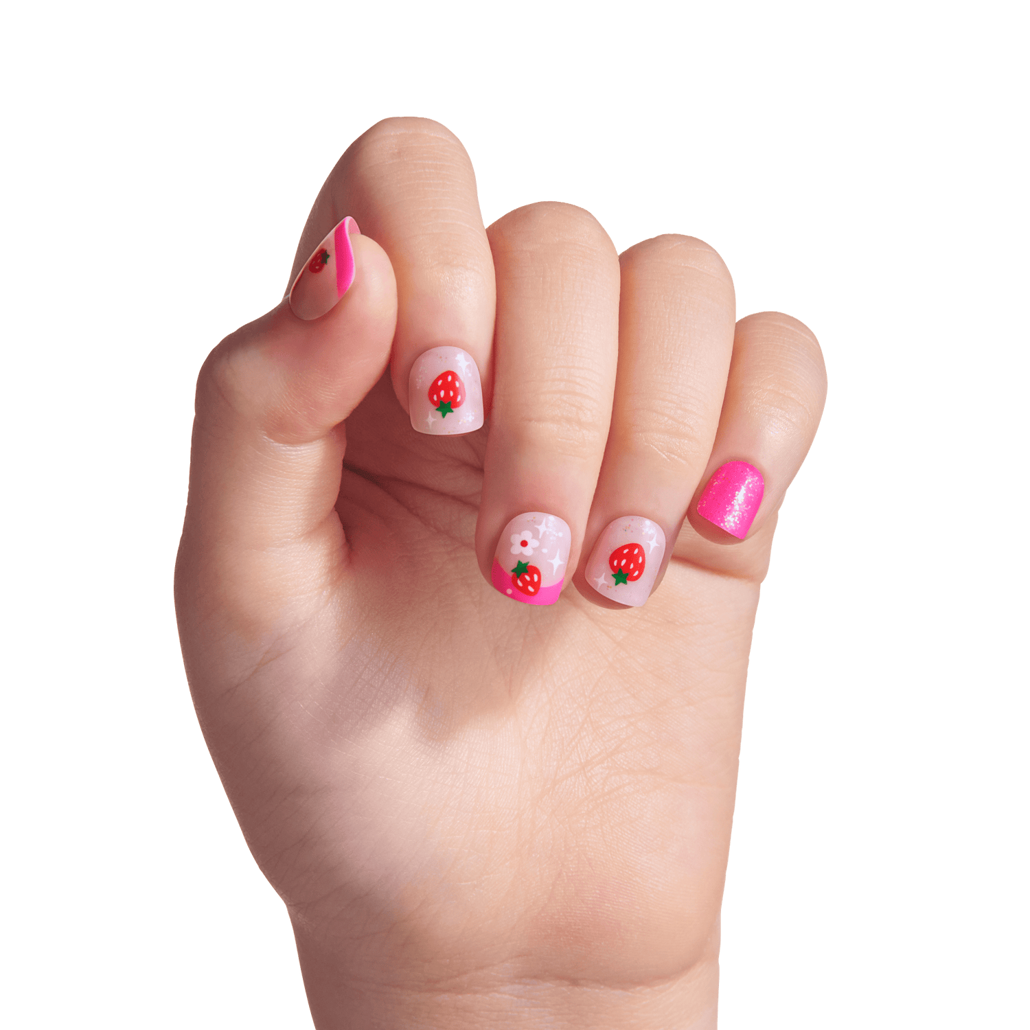 Hand displaying strawberry-themed nail art with pink and red designs on white base.