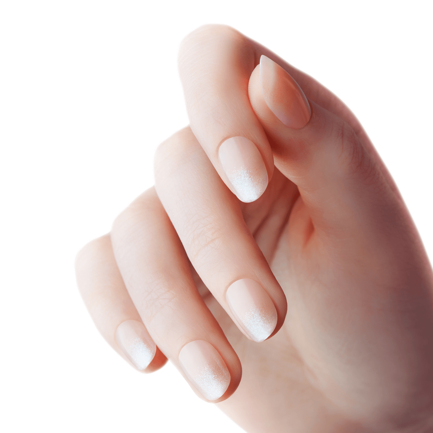 Hand with short oval-shaped nails featuring a soft pink base color and white glittery gradient tips, showcasing a delicate holiday nail design.