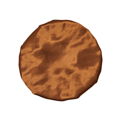 Round brown cookie with textured surface on white background.