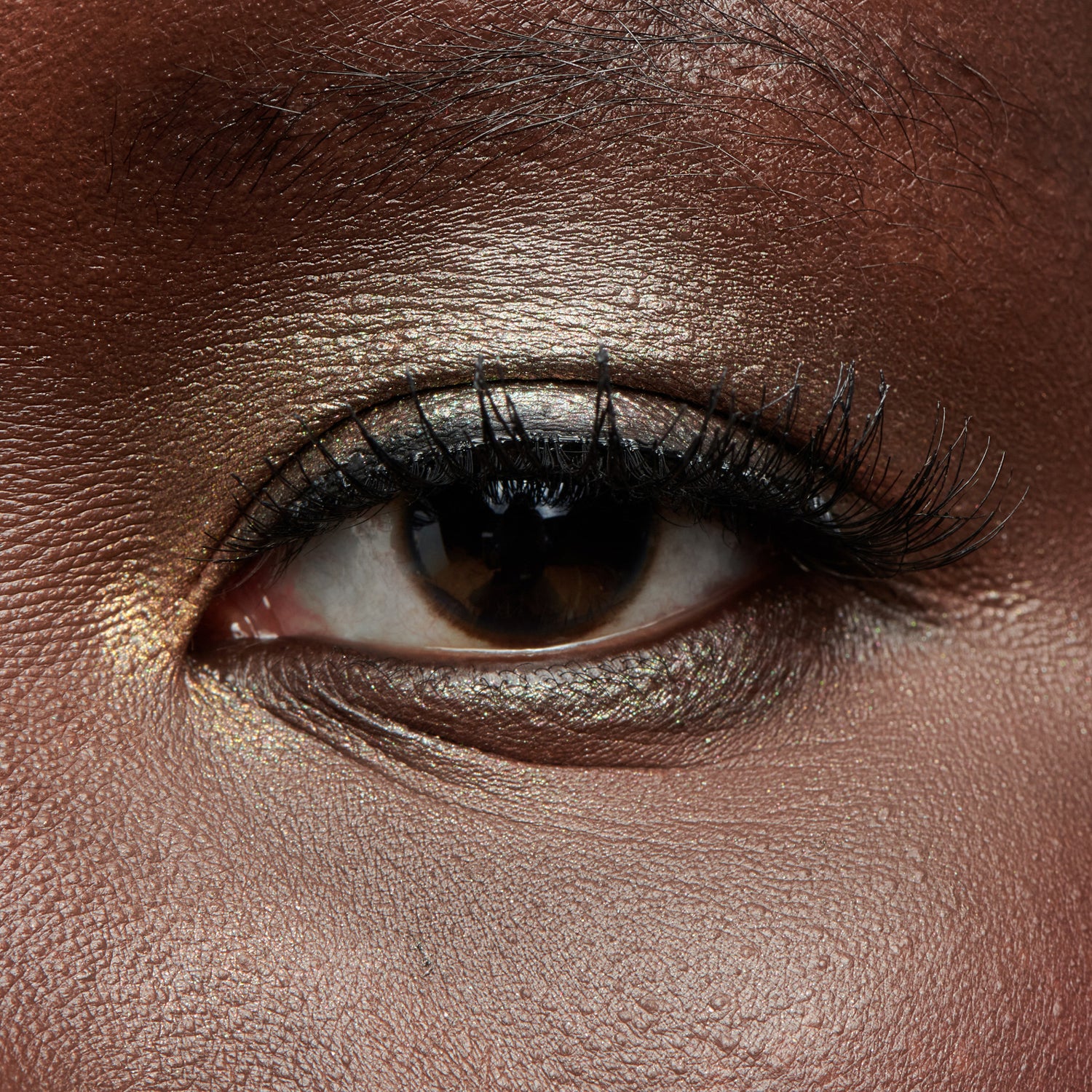 Close-up of a dark-skinned eye with makeup