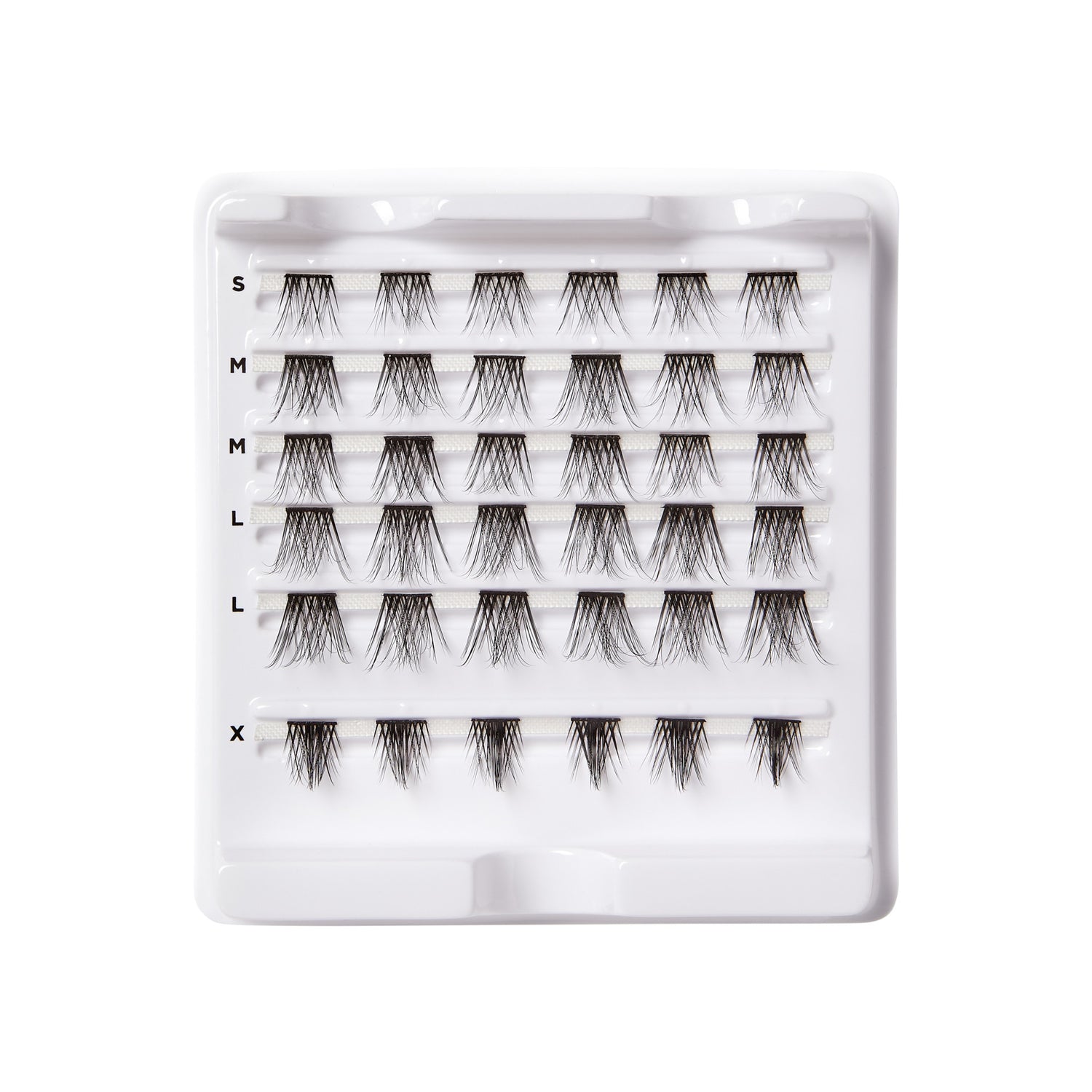 Tray of FALSCARA Wisps Special Edition Volumizing false eyelashes in five sizes, arranged in neat rows on a white plastic holder.