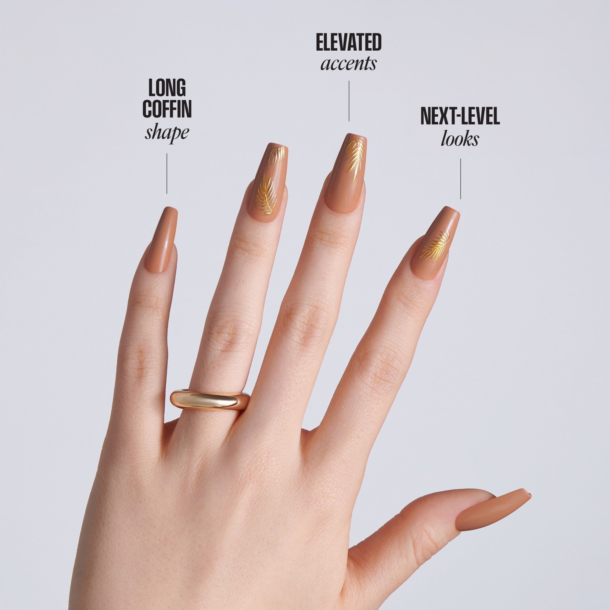 Hand with long coffin-shaped nude nails featuring gold leaf accents on a light gray background with text: Long Coffin Shape, Elevated Accents, Next-Level Looks