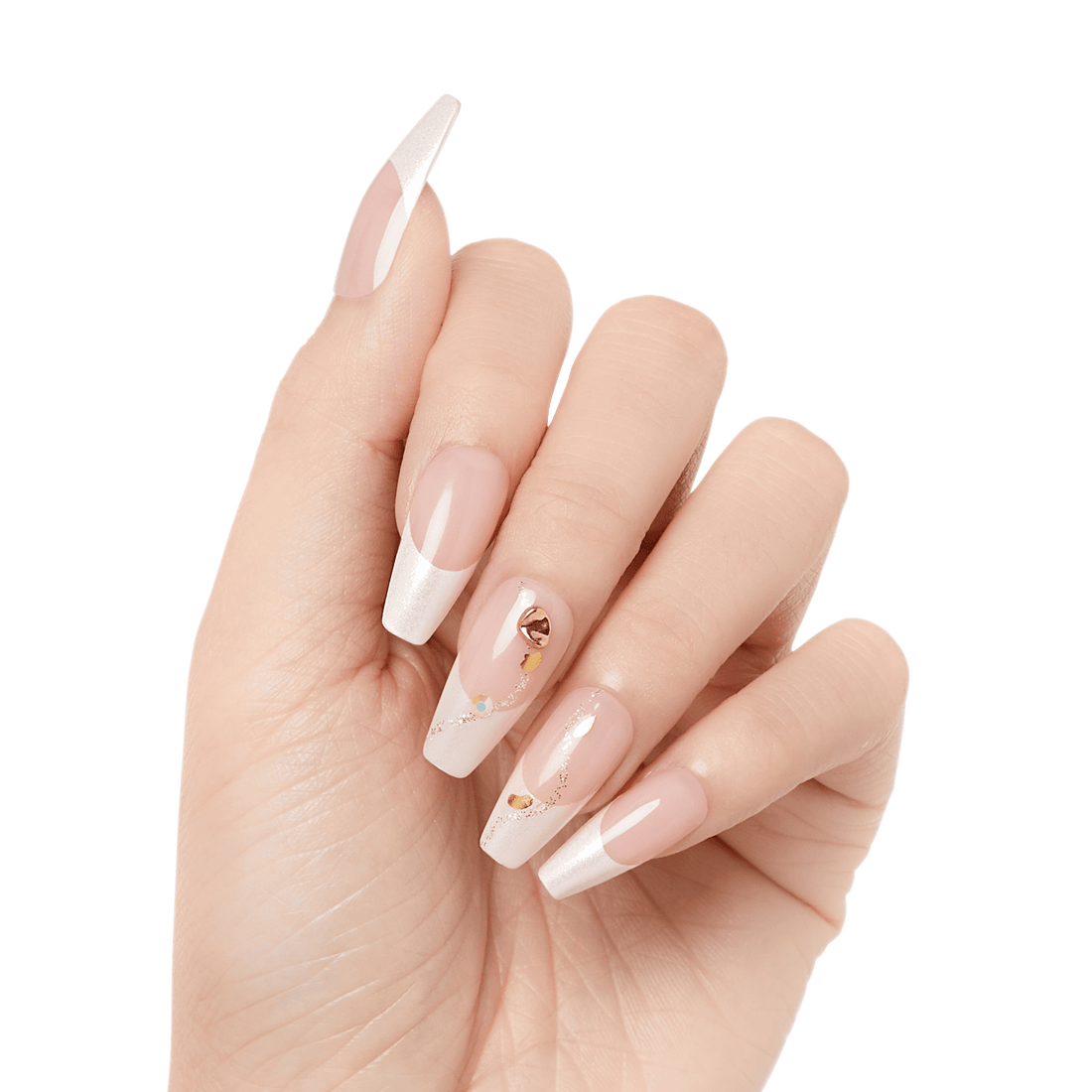 Hand with long, coffin-shaped press-on nails in light translucent pink and white tips, decorated with small gold and iridescent accents on middle fingers.