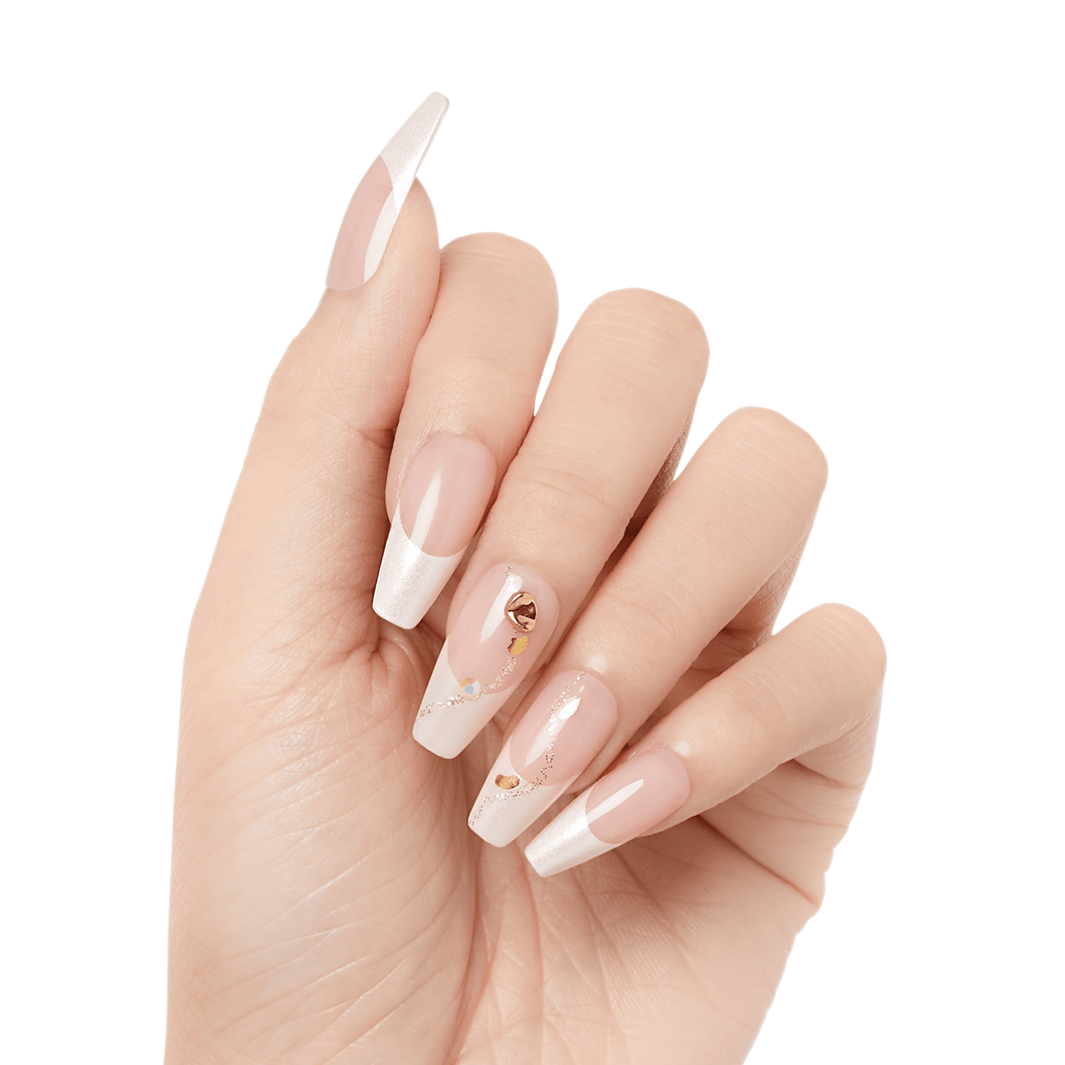 Hand with long, coffin-shaped press-on nails in light translucent pink and white tips, decorated with small gold and iridescent accents on middle fingers.