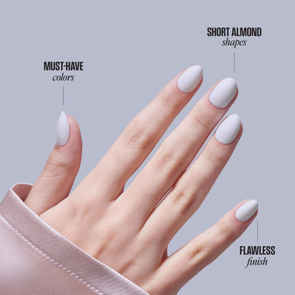 Short almond white nails with must-have colors and flawless finish demonstration.
