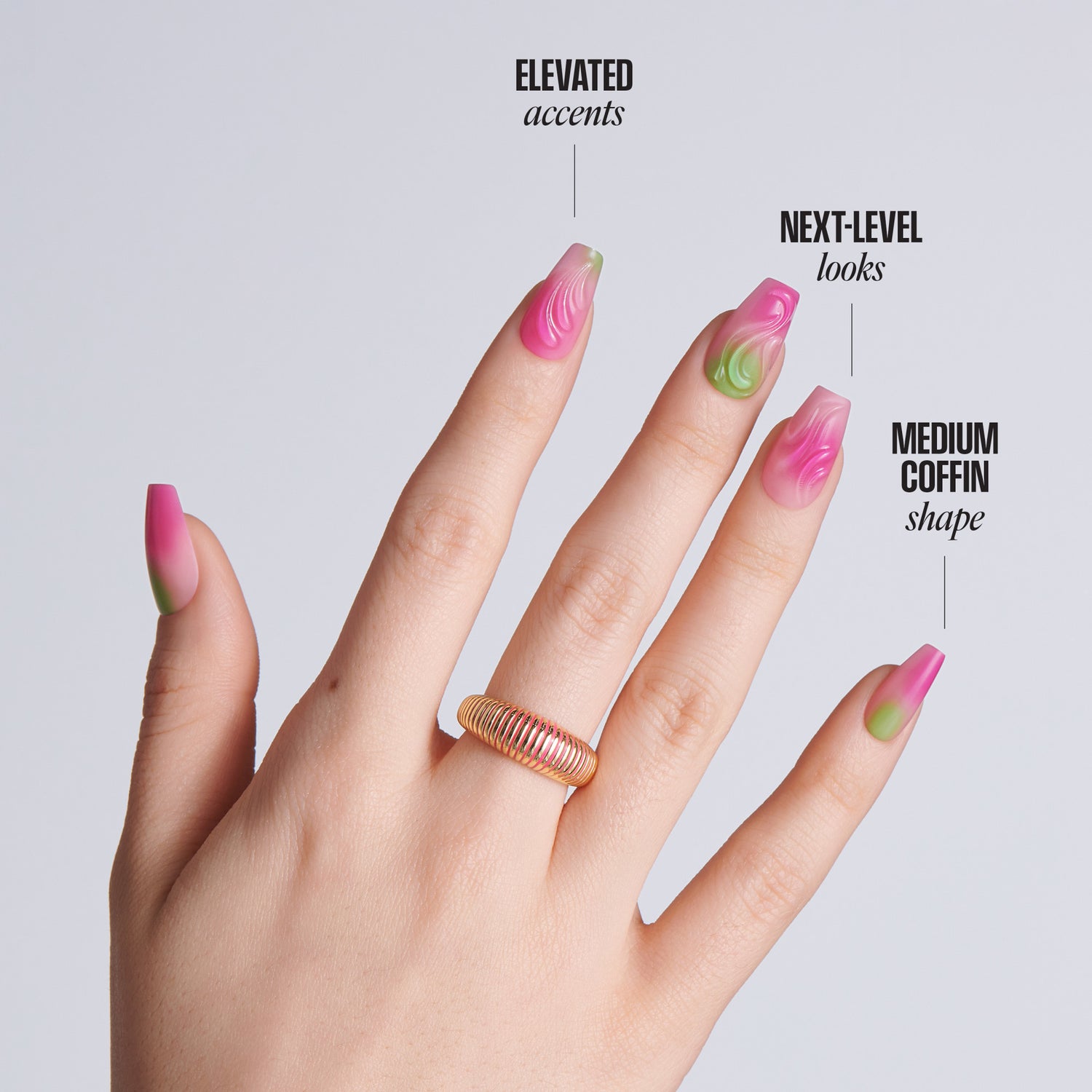 Hand with medium coffin-shaped nails featuring pink and green marble swirl designs with gold accents and a gold ring, with text: Elevated Accents, Next-Level Looks, Medium Coffin Shape